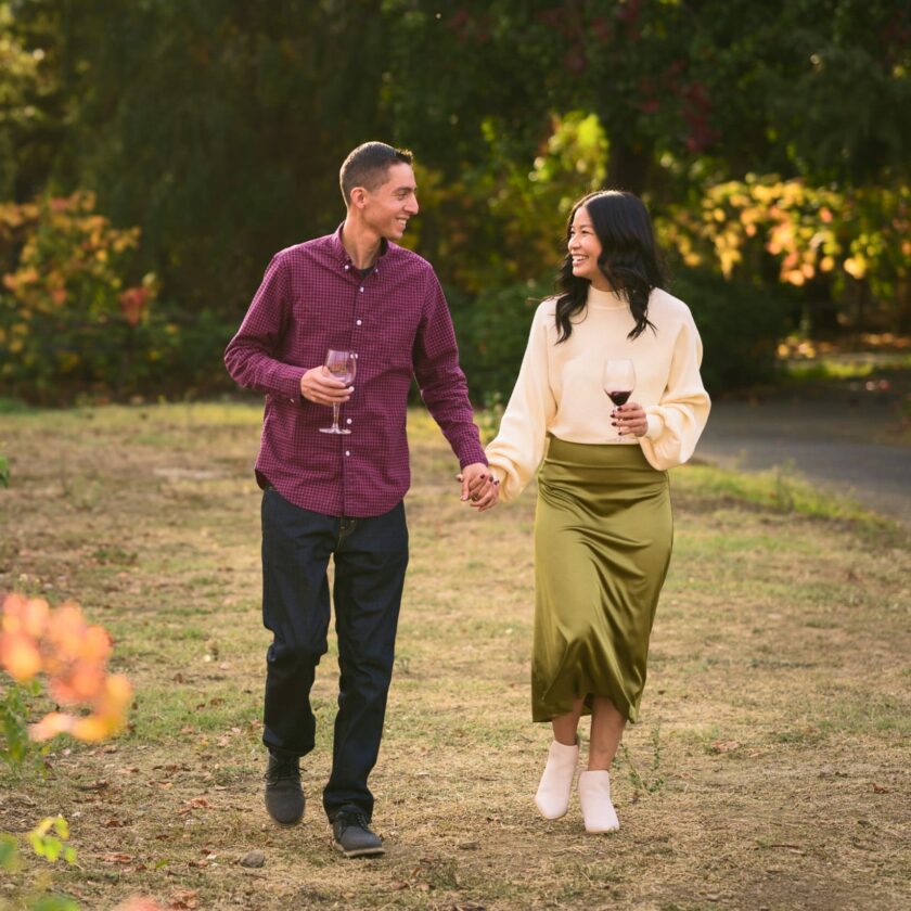 couple walking in the vineyard.