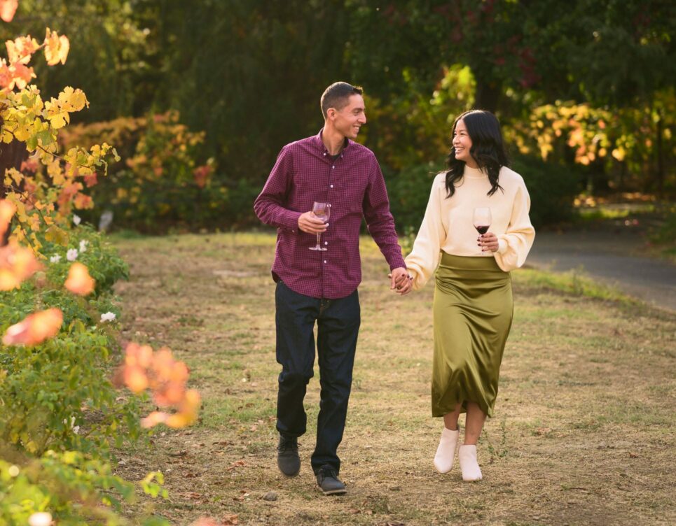 couple walking in the vineyard.